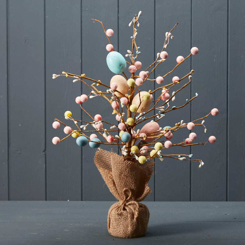 Easter tree with hessian skirt base and pastel colour easter eggs throughout