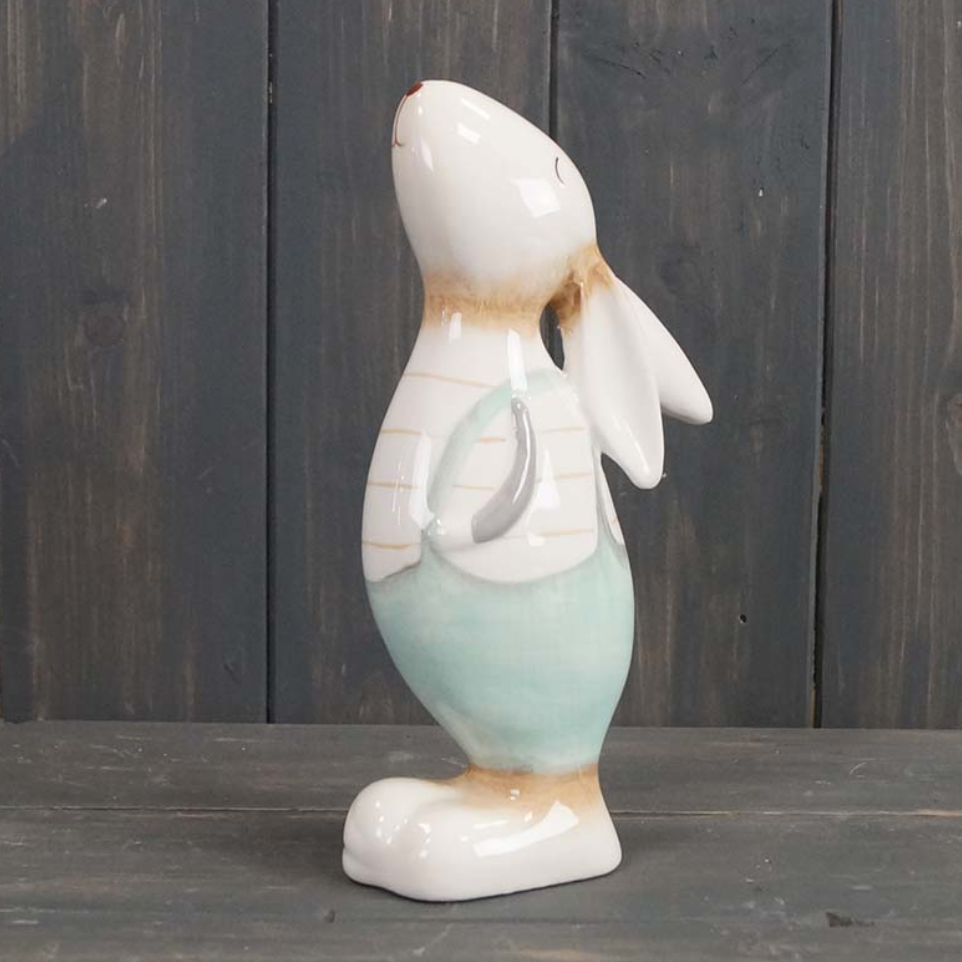ceramic glazed pastel coloured easter rabbit gazing upwards